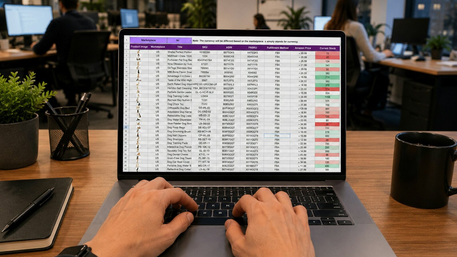 Hands typing into a spreadsheet on a laptop in an office