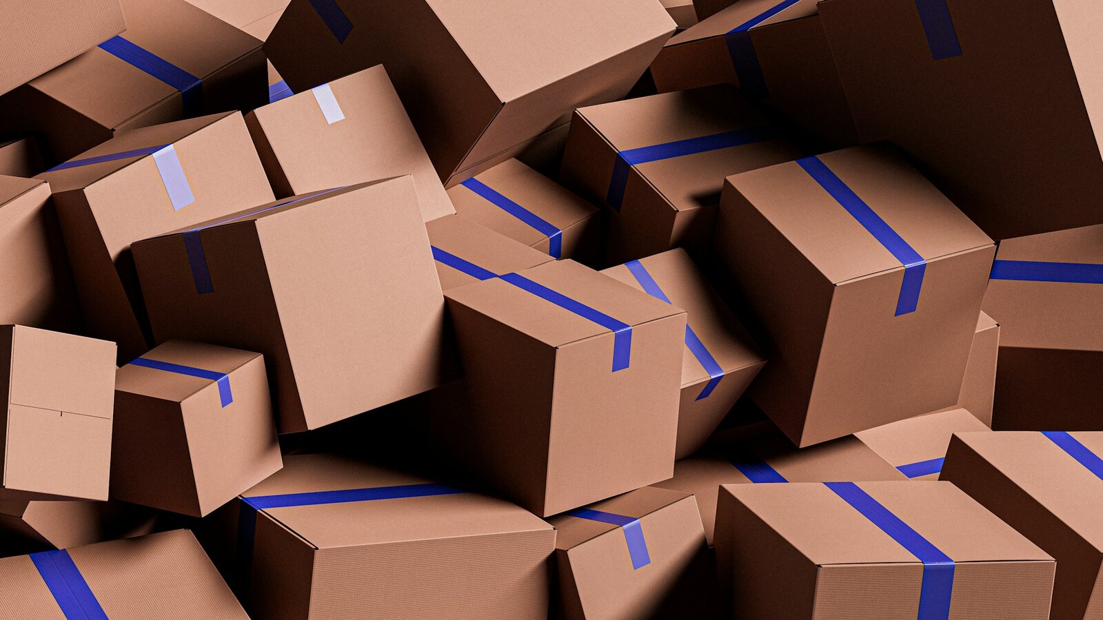 Pile of taped cardboard boxes ready to ship