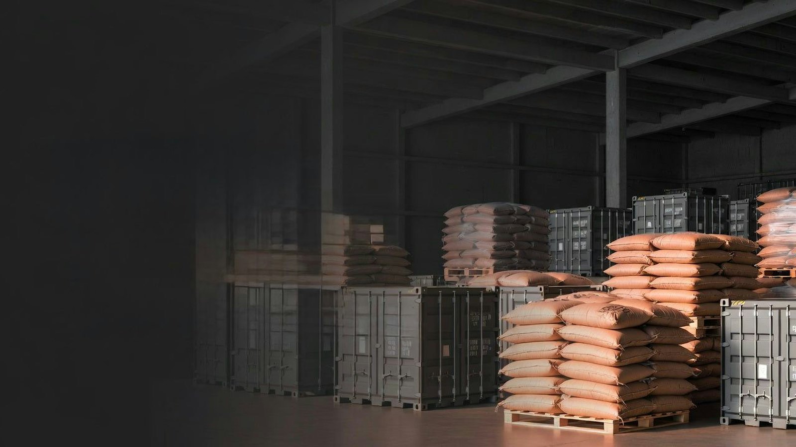 Stacks of sacks and containers stored in a warehouse