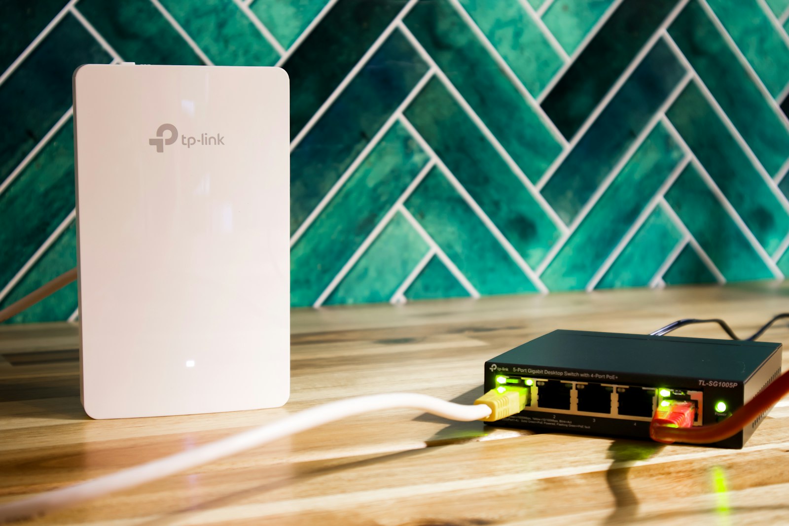 A Wi-Fi router and a network switch sitting side by side