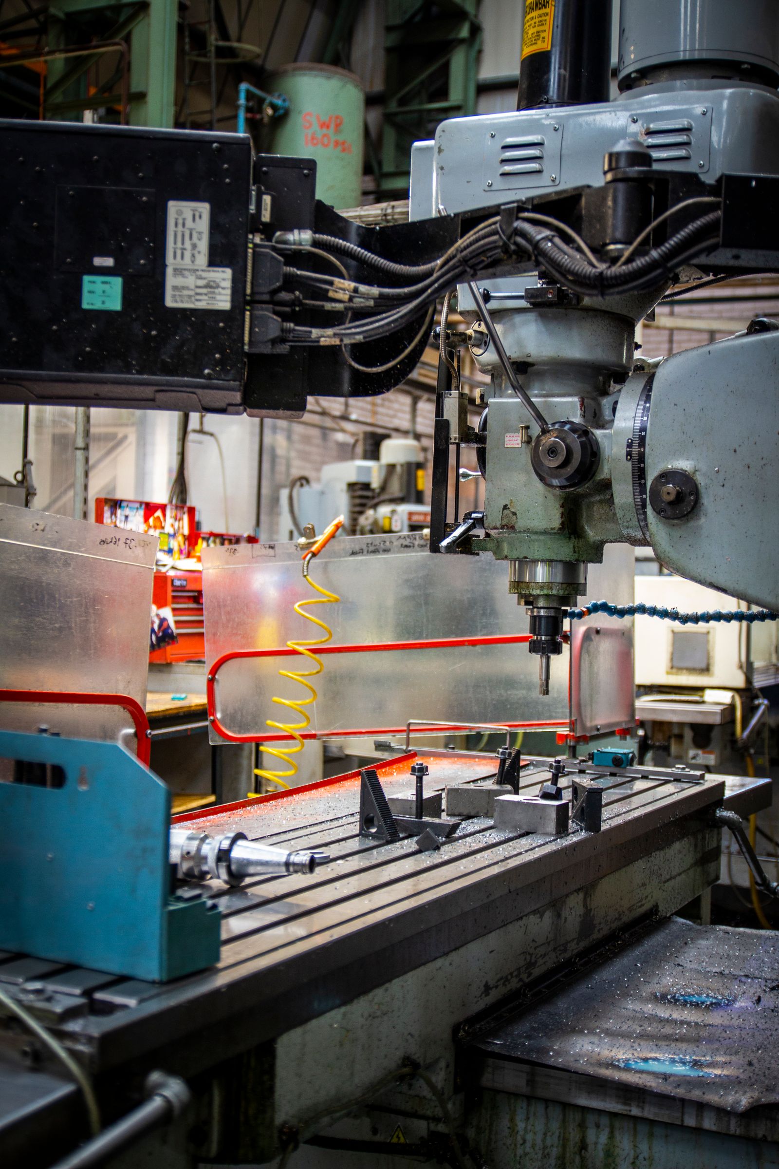 Close-up of an industrial CNC lathe in a machine shop